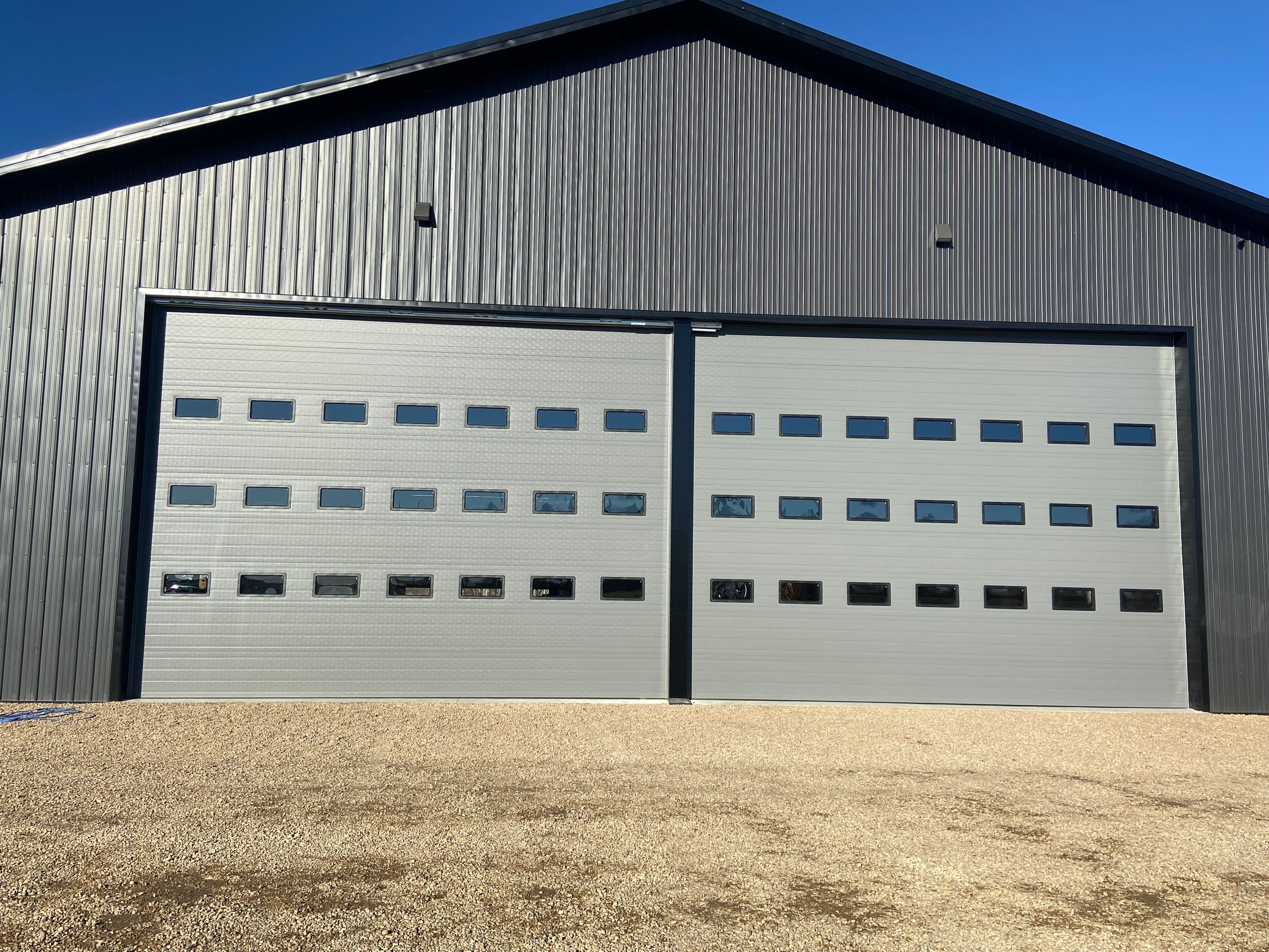 Extra wide dark barn doors with windows